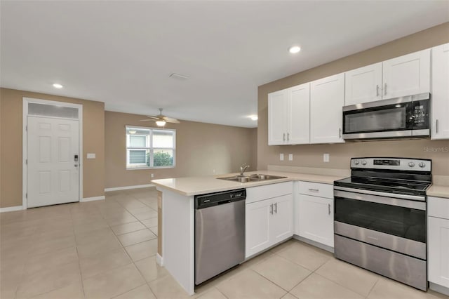 kitchen featuring white cabinetry, kitchen peninsula, and appliances with stainless steel finishes