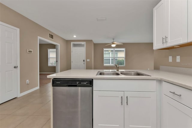 kitchen featuring dishwasher, a wealth of natural light, sink, and white cabinets