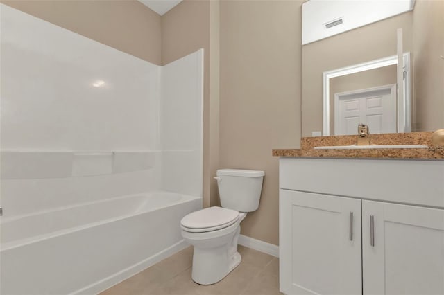 bathroom with tile patterned floors, vanity, and toilet