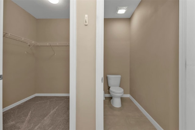 bathroom featuring tile patterned floors and toilet