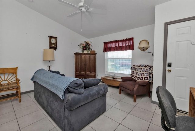 living room with lofted ceiling, ceiling fan, and light tile patterned floors