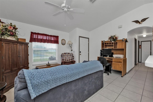 tiled bedroom featuring ceiling fan and lofted ceiling