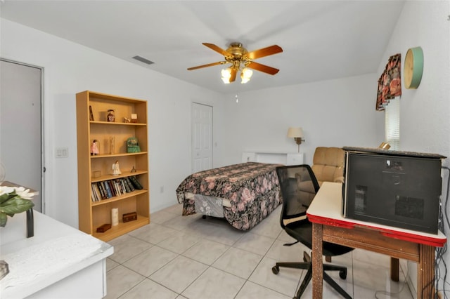 bedroom with light tile patterned floors and ceiling fan