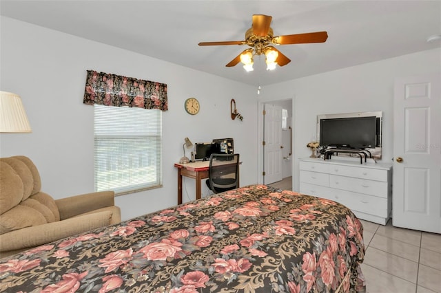 tiled bedroom featuring ceiling fan