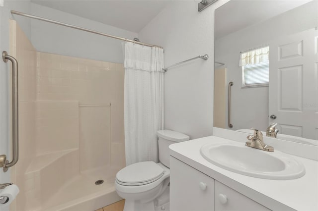 bathroom with vanity, a shower with curtain, toilet, and tile patterned flooring