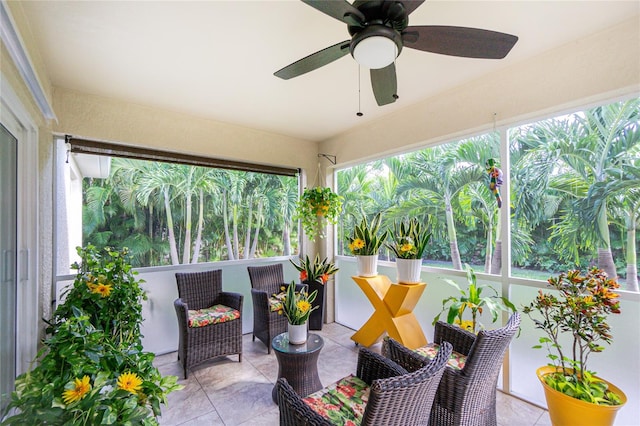 sunroom featuring ceiling fan