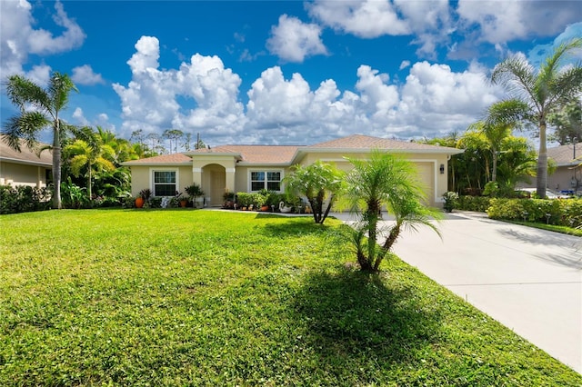 view of front of property featuring a garage and a front lawn