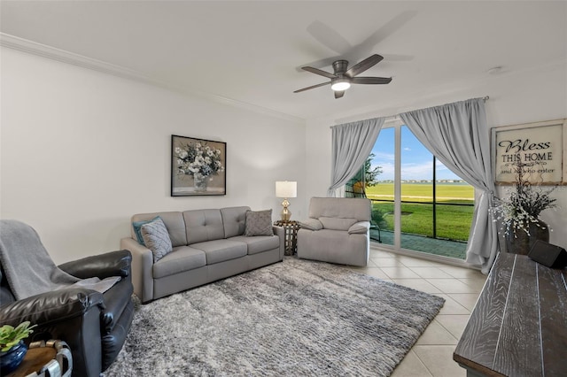 tiled living room featuring ceiling fan and crown molding