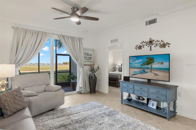 tiled living room with ceiling fan and ornamental molding