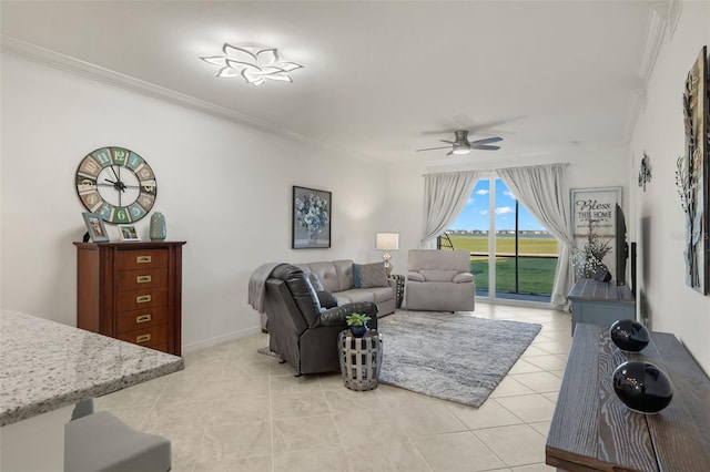 living room featuring ceiling fan, light tile patterned floors, and crown molding