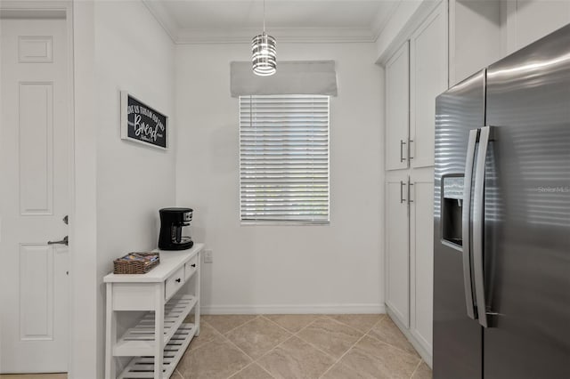 kitchen with stainless steel fridge with ice dispenser, decorative light fixtures, white cabinetry, and ornamental molding