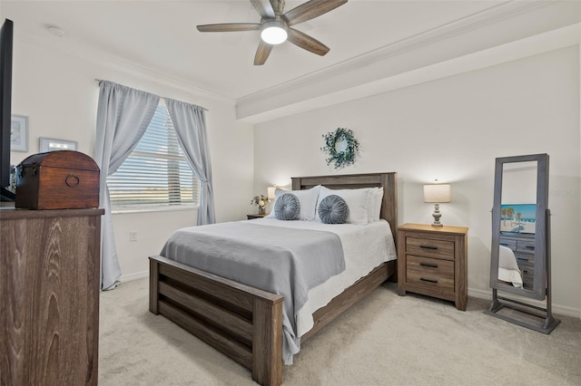 carpeted bedroom featuring ceiling fan and crown molding