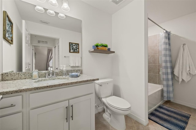 full bathroom featuring tile patterned flooring, vanity, toilet, and shower / tub combo