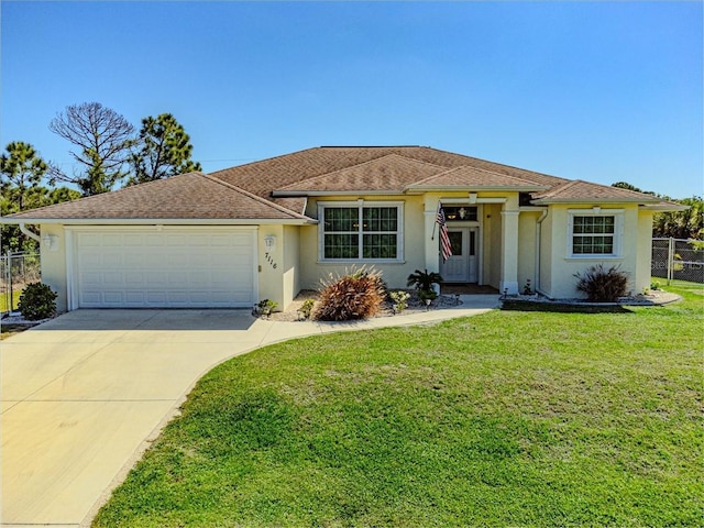 ranch-style house with fence, a front lawn, a garage, stucco siding, and driveway