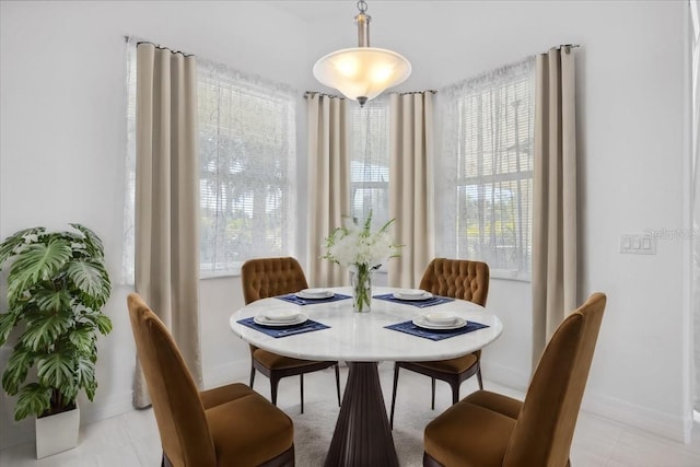 dining space with baseboards