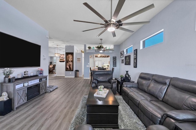 living room with hardwood / wood-style floors and ceiling fan