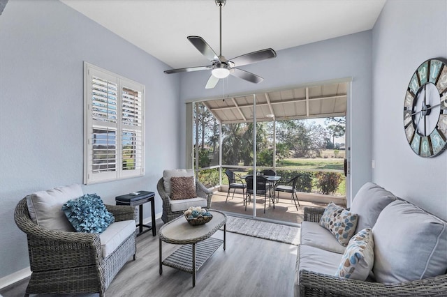 interior space with ceiling fan