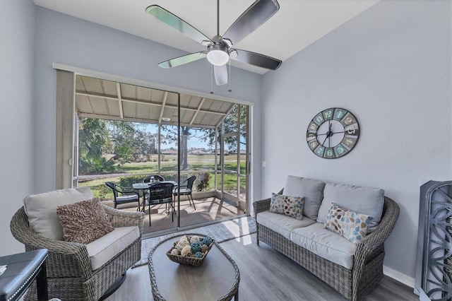 living room with hardwood / wood-style floors and ceiling fan