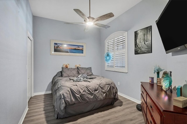 bedroom featuring light wood-type flooring and ceiling fan