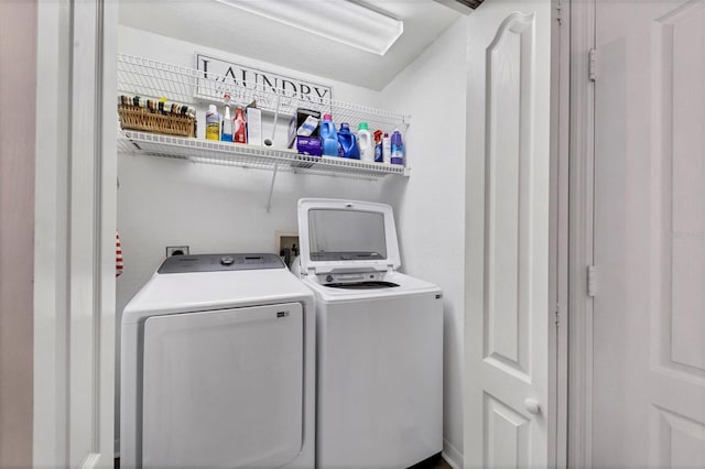 clothes washing area with independent washer and dryer