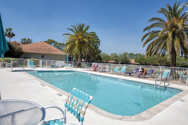 view of swimming pool with a patio