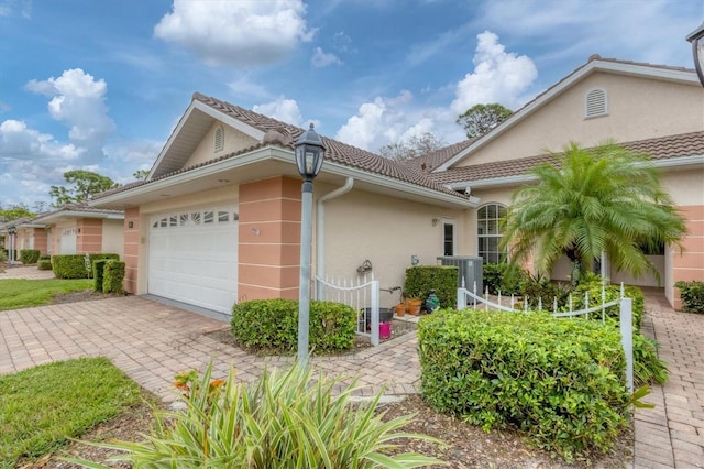 view of side of home with a garage