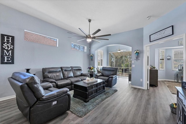 living room with ceiling fan and wood-type flooring