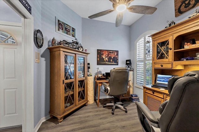 office featuring hardwood / wood-style flooring and ceiling fan