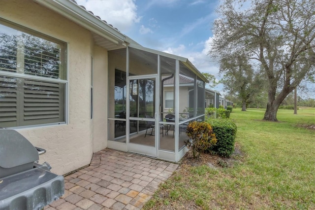 exterior space featuring a yard and a lanai