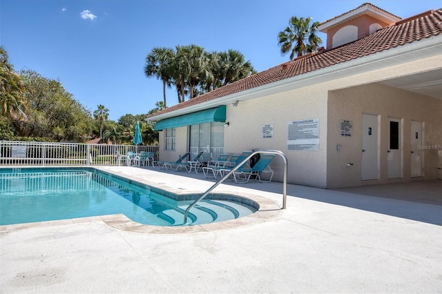 view of swimming pool featuring a patio area