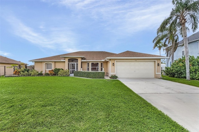 view of front of house featuring a garage and a front yard