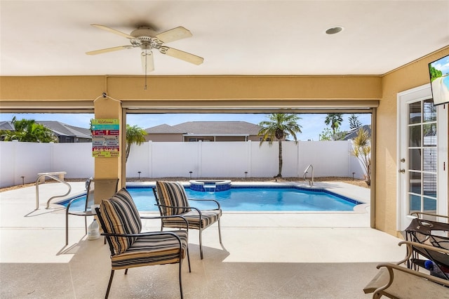 view of pool featuring ceiling fan and a patio area