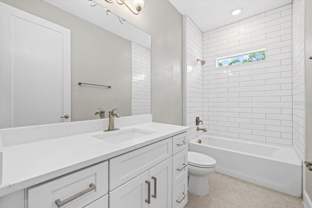 full bathroom with tile patterned flooring, vanity, toilet, and tiled shower / bath