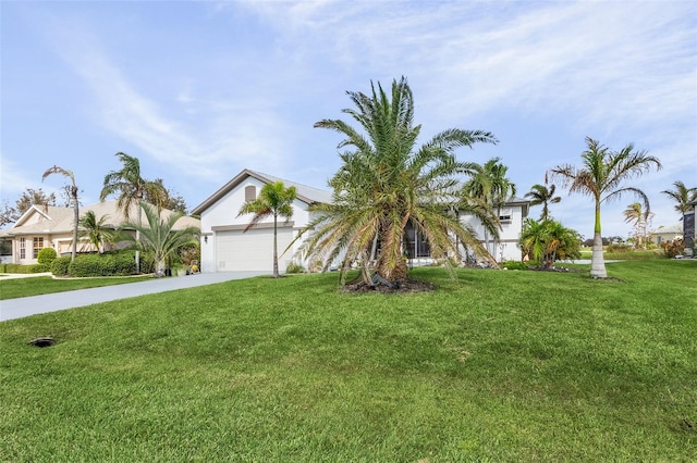 view of front facade with a front yard and a garage