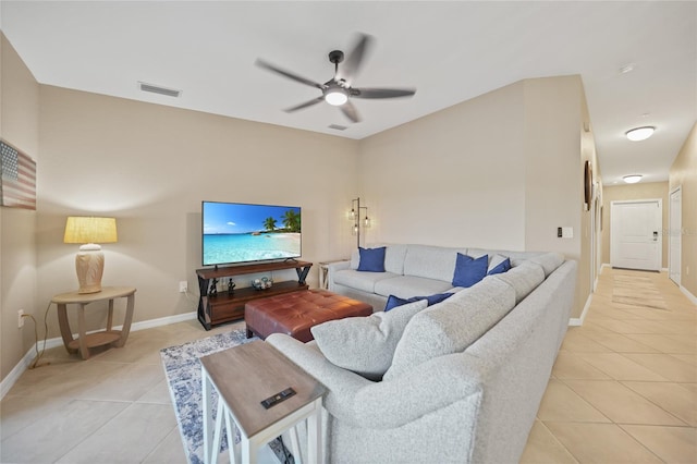 tiled living room featuring ceiling fan