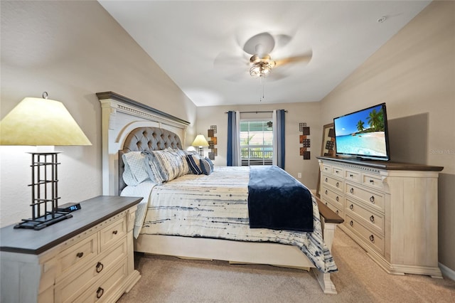 carpeted bedroom featuring lofted ceiling and ceiling fan