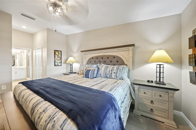 carpeted bedroom with connected bathroom and ceiling fan