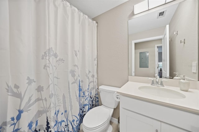 bathroom with toilet, electric panel, a shower with curtain, and vanity