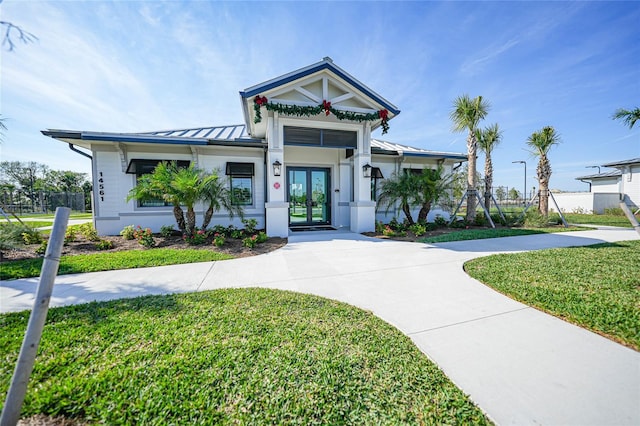 14271 Heritage Landing Blvd Unit 1526, Punta Gorda, FL 33955 - view of front of property with a standing seam roof, french doors, metal roof, and a front yard