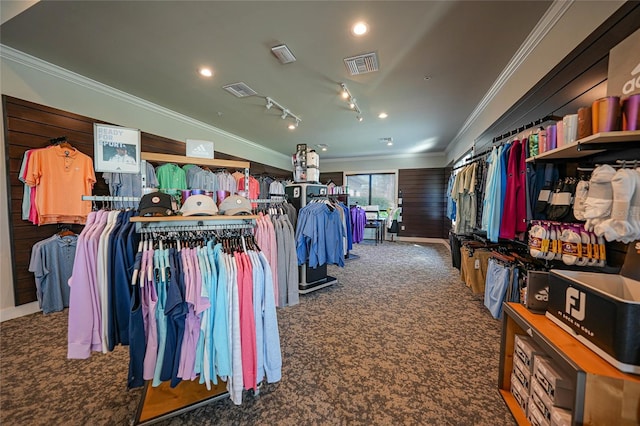 walk in closet featuring dark colored carpet