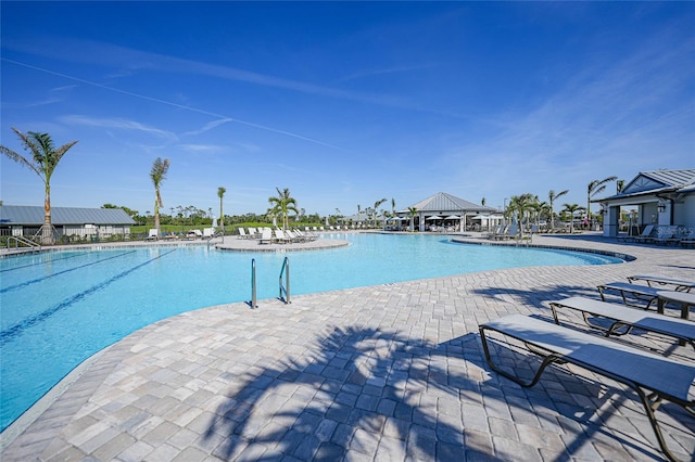 view of swimming pool with a patio area