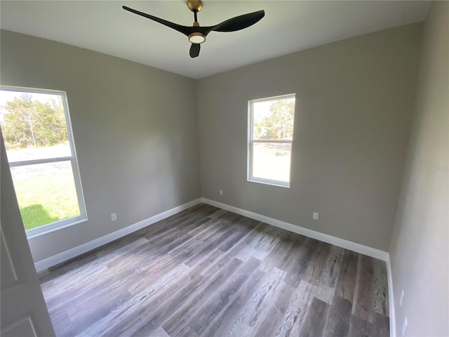 unfurnished room with hardwood / wood-style flooring and ceiling fan