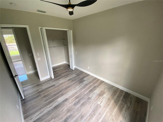 unfurnished bedroom with a closet, ceiling fan, and hardwood / wood-style floors