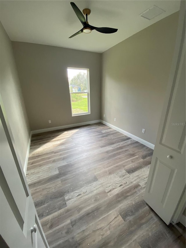 unfurnished room featuring light hardwood / wood-style flooring and ceiling fan