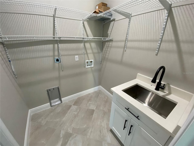 laundry area featuring cabinets, hookup for a washing machine, electric dryer hookup, and sink