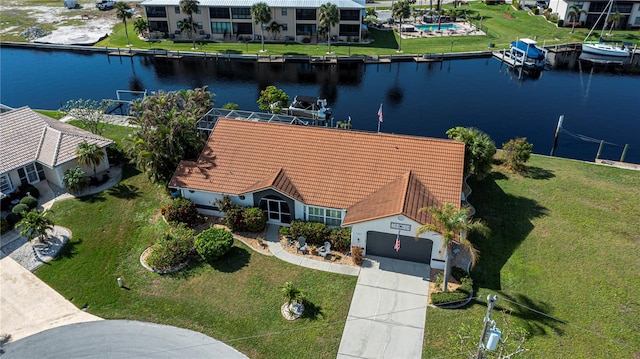 aerial view featuring a residential view and a water view