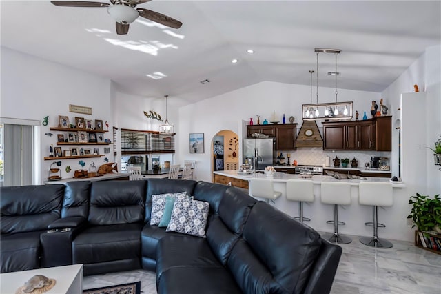 living room featuring lofted ceiling and ceiling fan