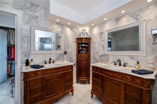 bathroom with tile walls and vanity