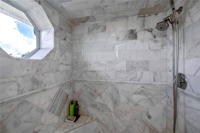 bathroom with tiled shower