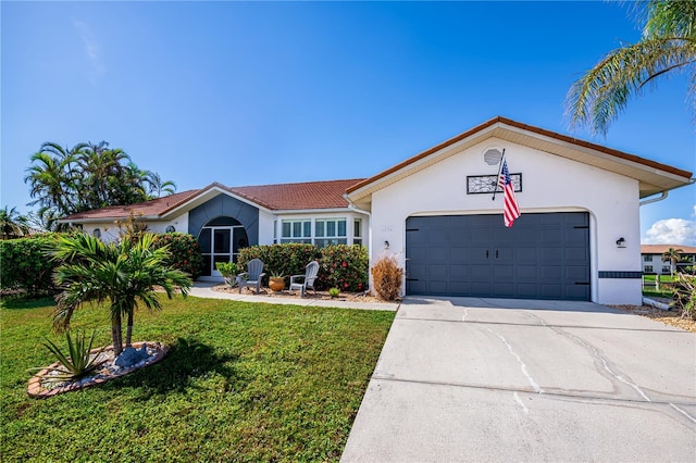 ranch-style house featuring a garage, stucco siding, driveway, and a front yard